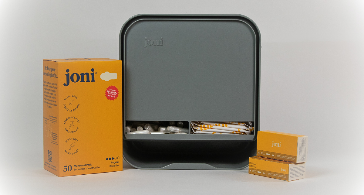 JONI Model A dispenser on counter with regular pads and tampons