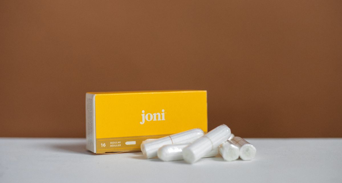 joni's regular digital tampons with a brown background