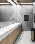Modern restroom featuring Model V Smart Free-vend Period Care Dispenser on the wall.
