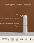 joni organic cotton tampon with certified compostable wrapper on a neutral background.