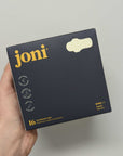 Organic Bamboo Incontinence Pads package held in hand, featuring 16 ultra-thin, leak-proof pads by joni.