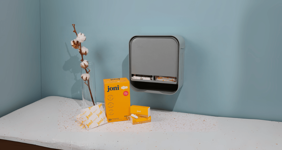 joni Model A open dispenser hanging on a wall
