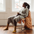 A woman with PMDD looks out a window