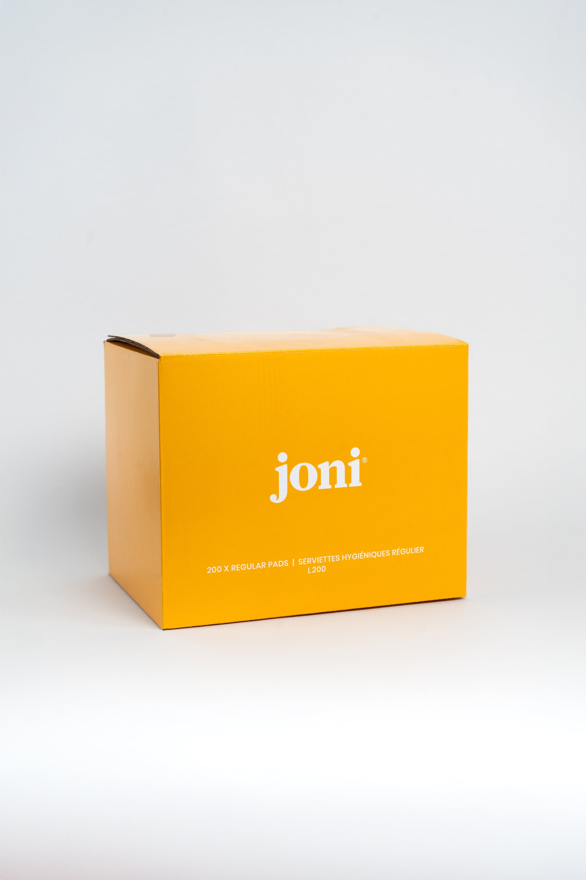 Yellow bulk box of joni regular pads for commercial washrooms
