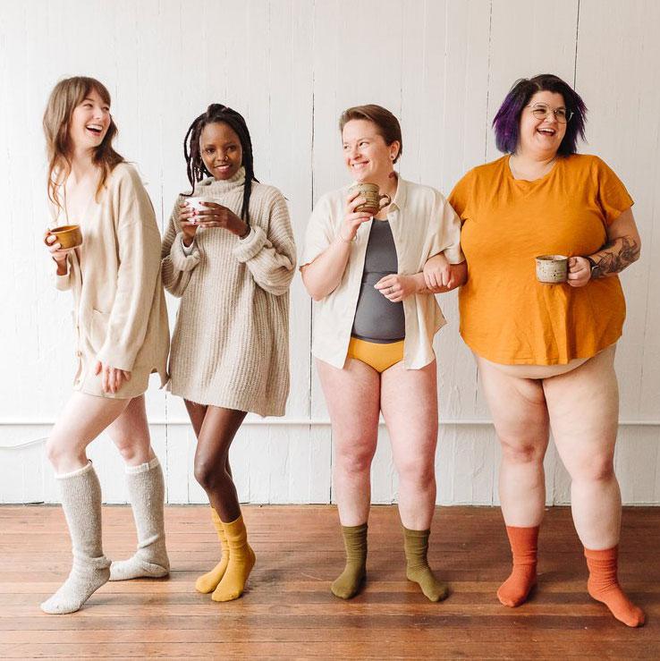Four diverse people who menstruate to depict plastic free period care for every body.
